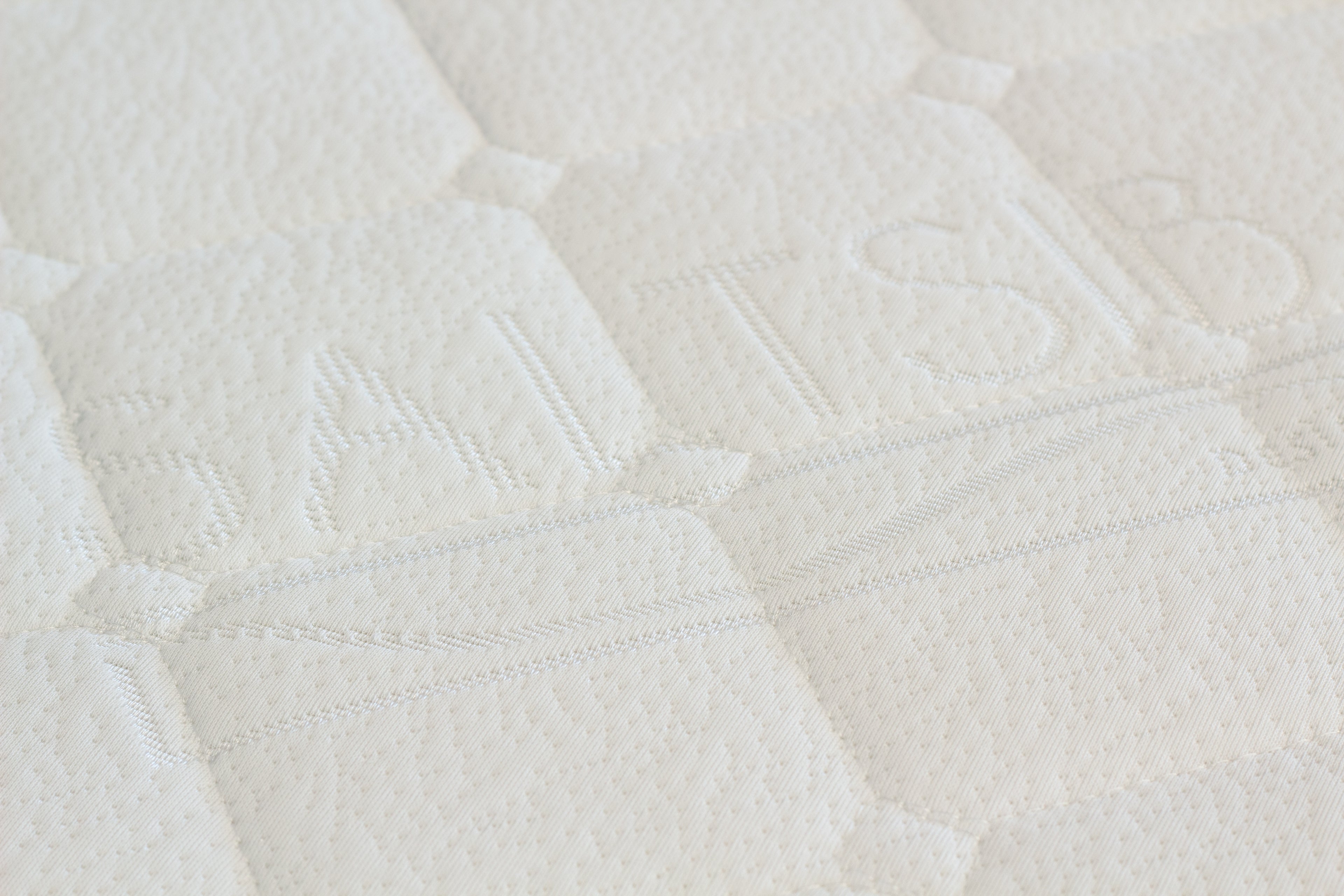 Close-up of a textured white fabric surface