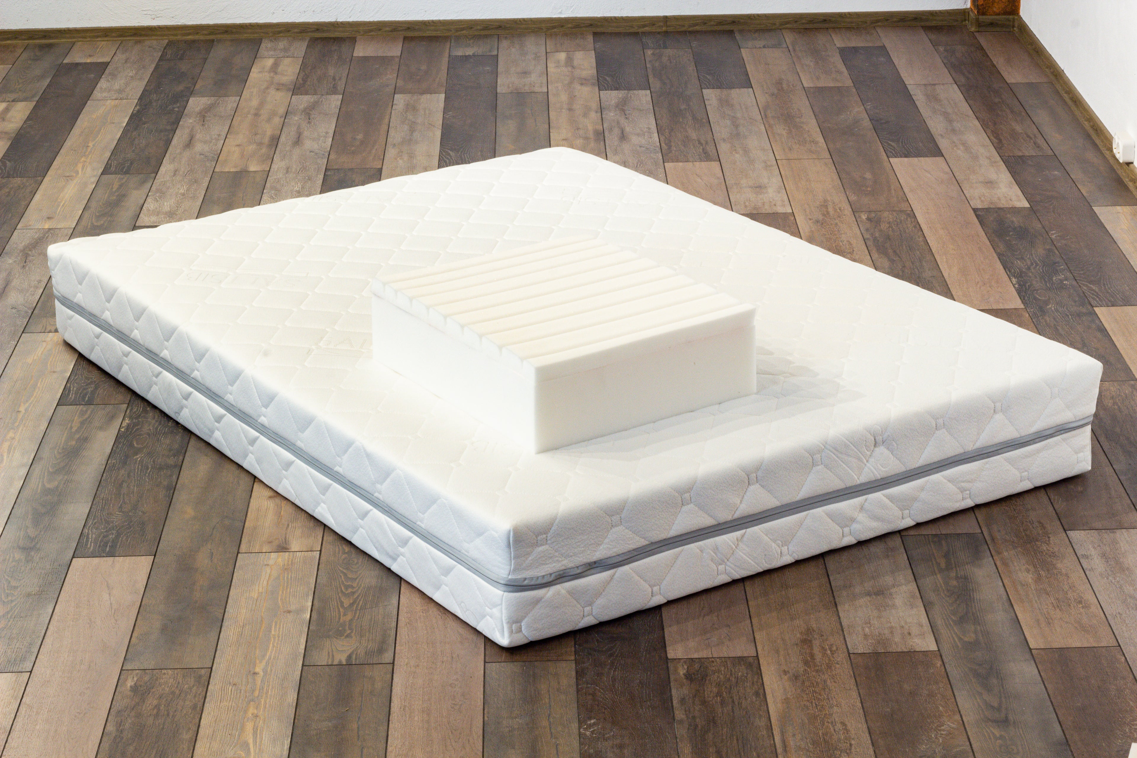 Mattress on a wooden floor