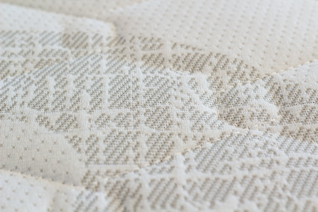 Close-up of a textured beige fabric surface