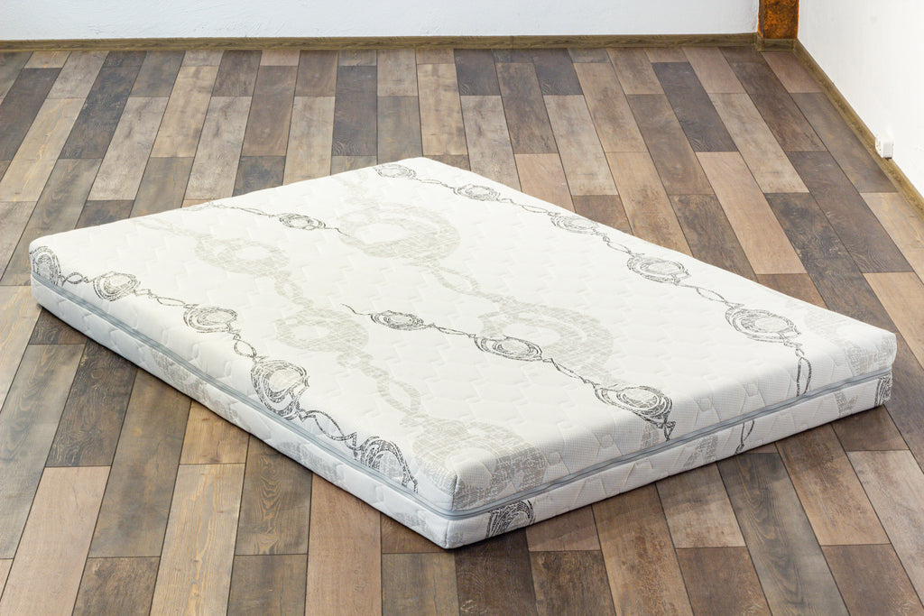 Mattress on a wooden floor