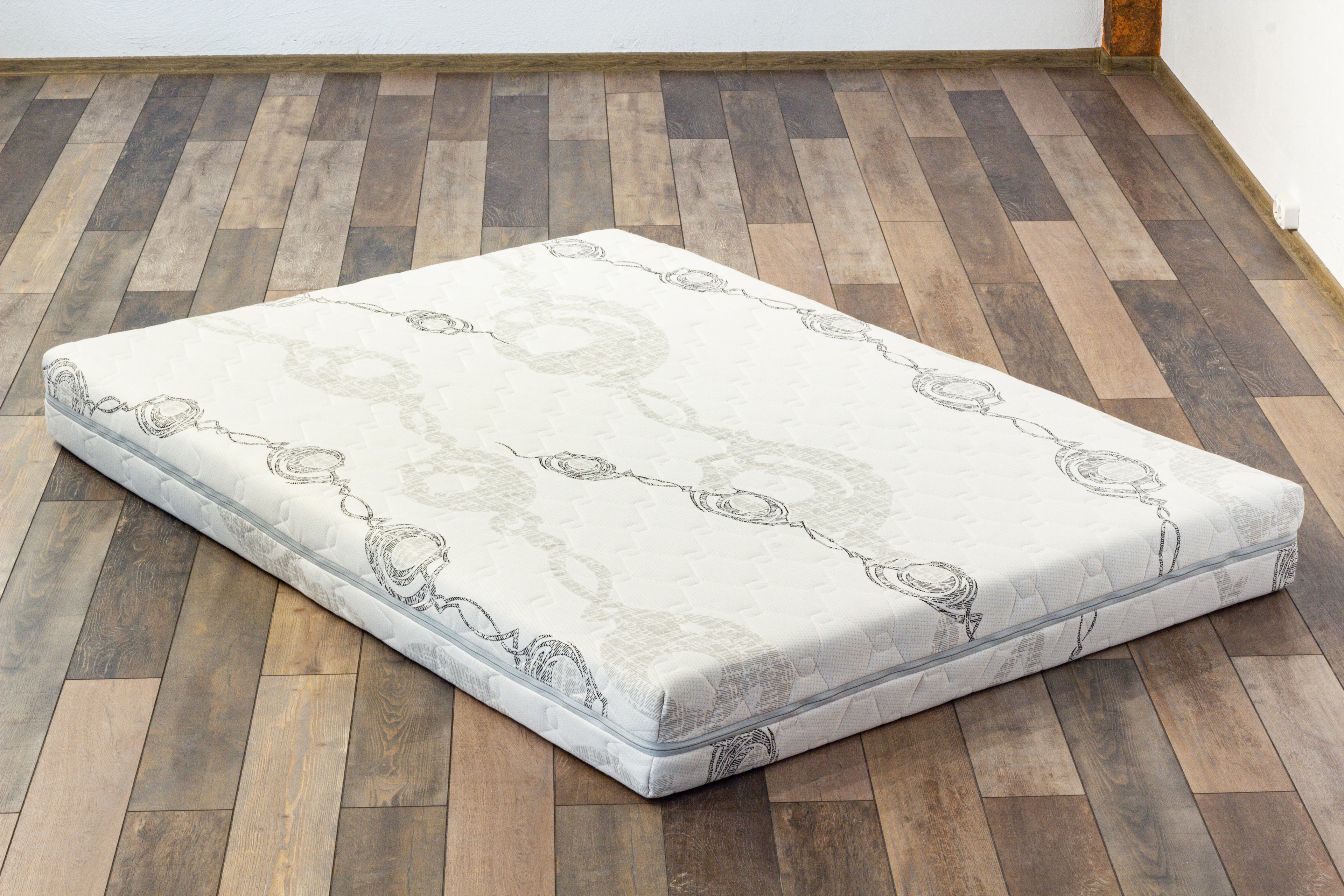 Mattress on a wooden floor