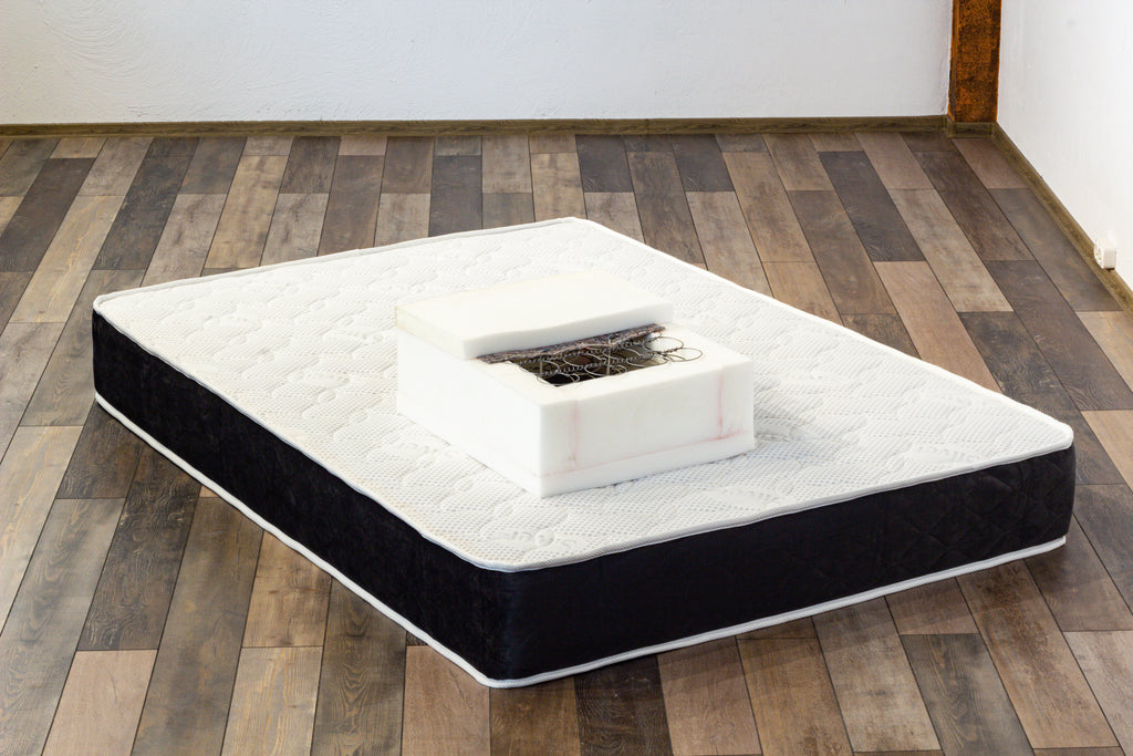 Mattress on a wooden floor